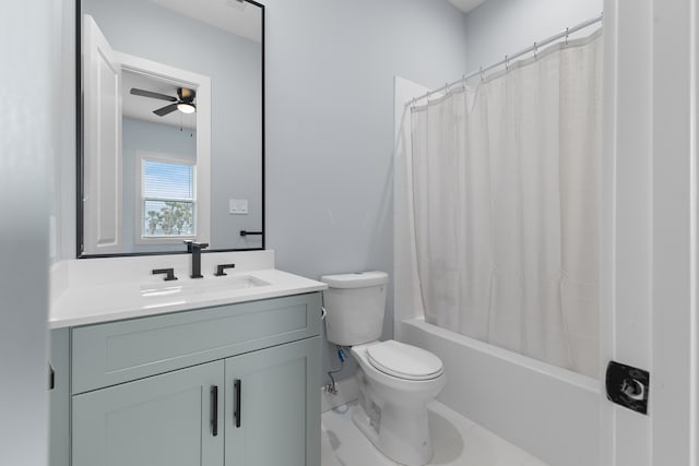 full bathroom featuring shower / tub combo, tile flooring, toilet, ceiling fan, and large vanity