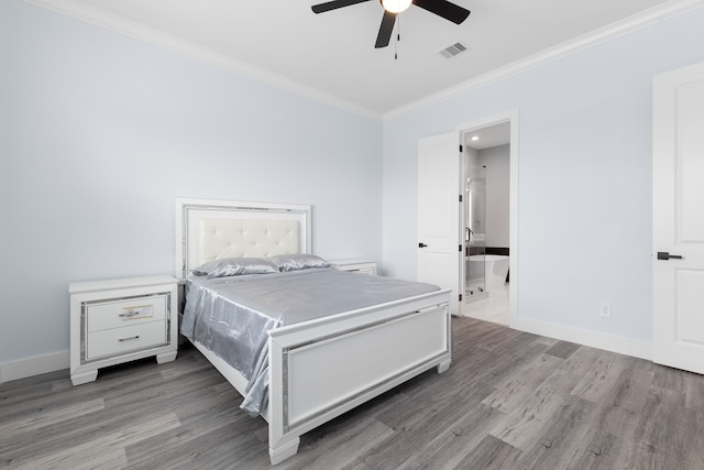 bedroom featuring hardwood / wood-style floors, connected bathroom, ceiling fan, and ornamental molding