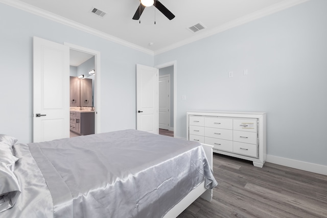 bedroom with ornamental molding, ceiling fan, ensuite bath, and dark wood-type flooring