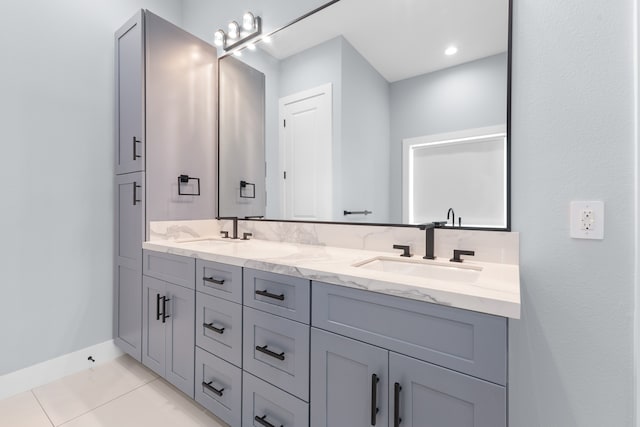 bathroom featuring tile flooring and double vanity