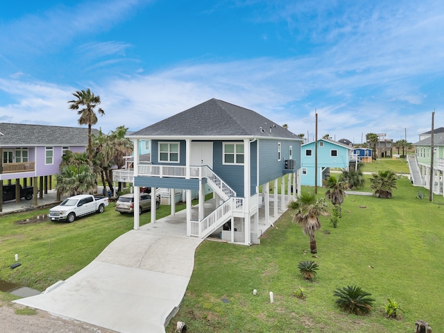 raised beach house with a front lawn