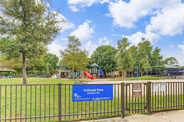 view of community with a lawn and a playground