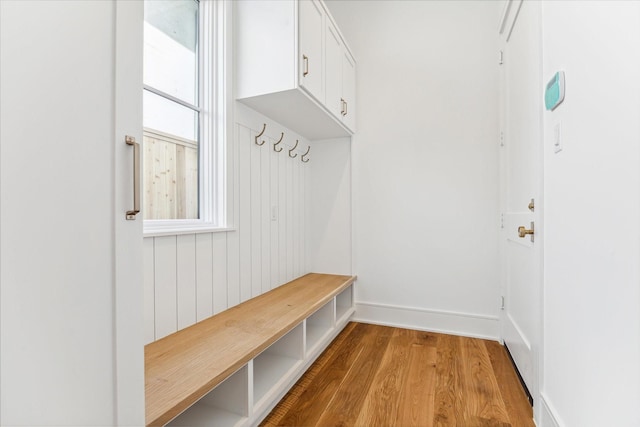 mudroom with light hardwood / wood-style floors