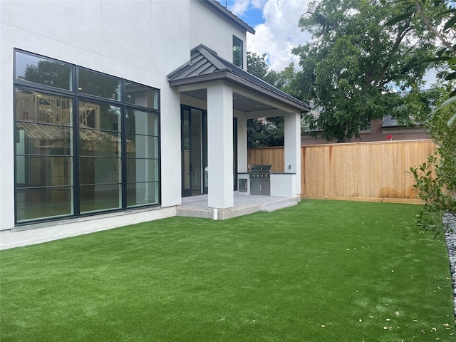 view of yard featuring exterior kitchen