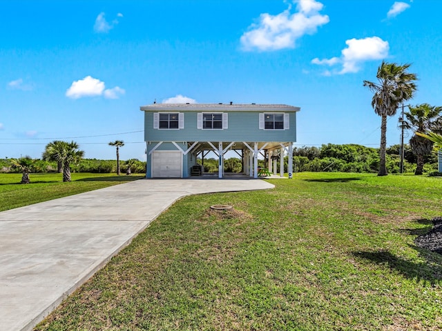 view of front of property with a front yard and a garage