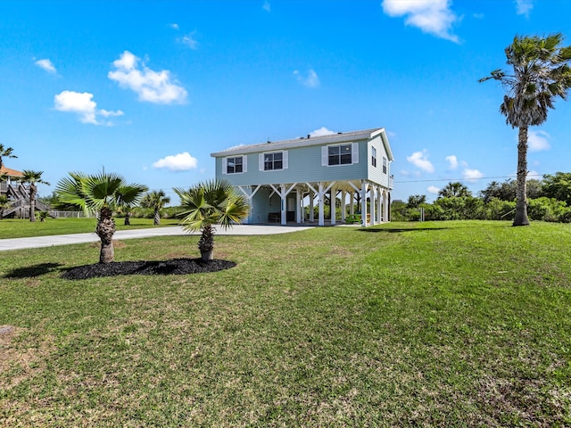 rear view of house with a lawn