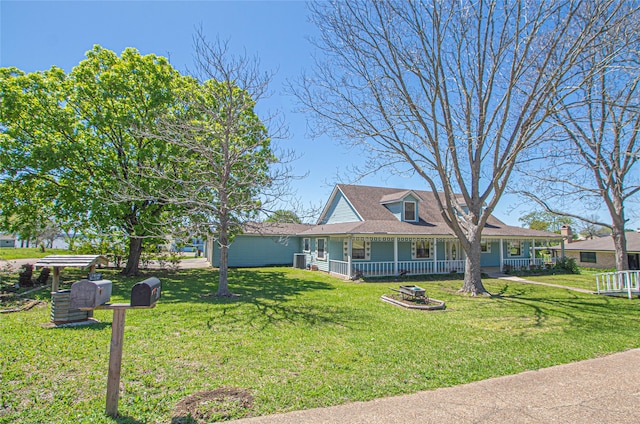 view of front facade with a front yard and a porch