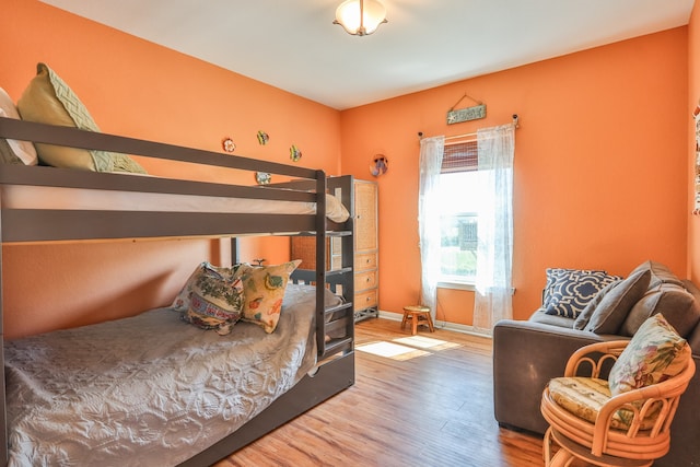 bedroom with wood-type flooring