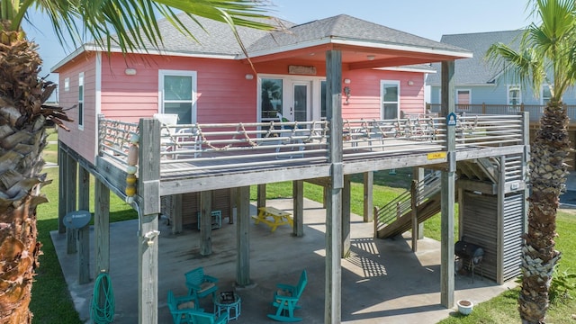 back of house featuring a patio area and a deck