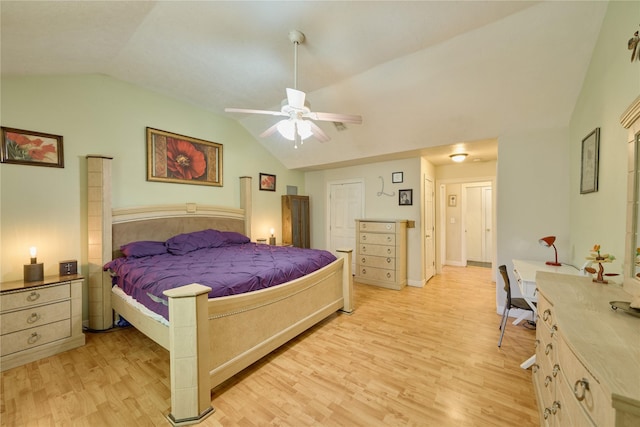 bedroom with lofted ceiling, a ceiling fan, and light wood-style floors