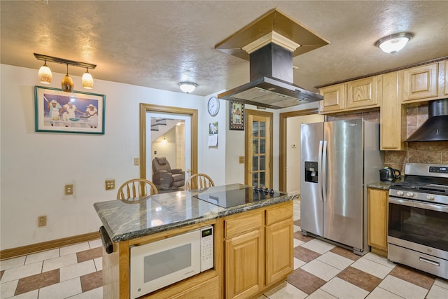 kitchen with light tile patterned floors, stainless steel appliances, wall chimney exhaust hood, decorative backsplash, and island range hood