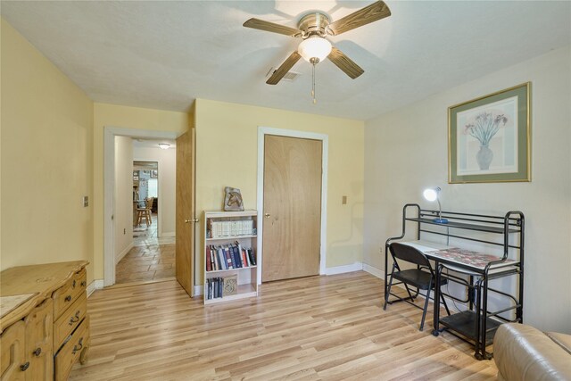 dining room with light hardwood / wood-style floors and ceiling fan