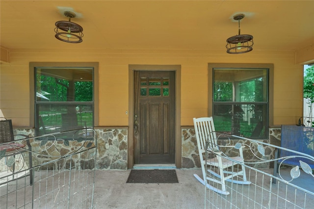 entrance to property with stone siding