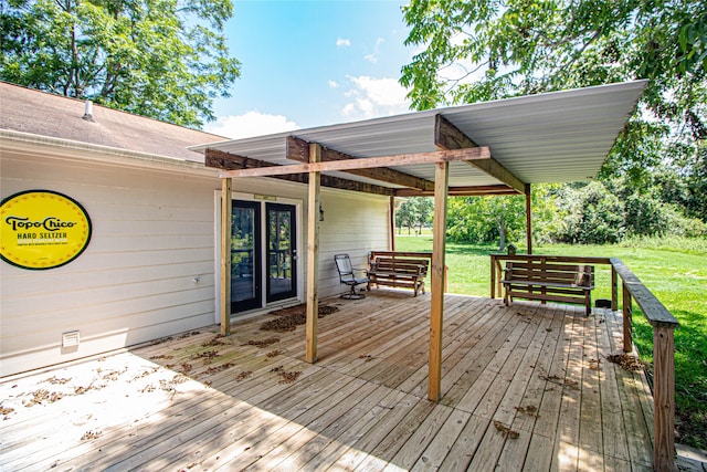 wooden deck with a lawn