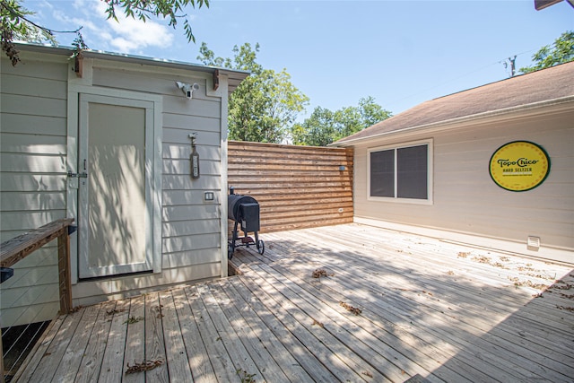 wooden terrace featuring area for grilling