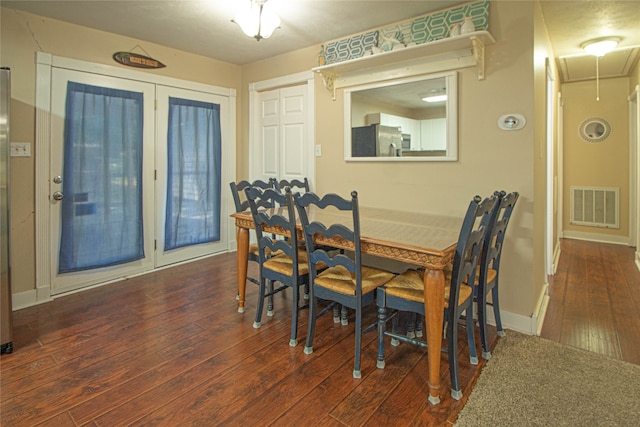 dining room featuring dark hardwood / wood-style flooring