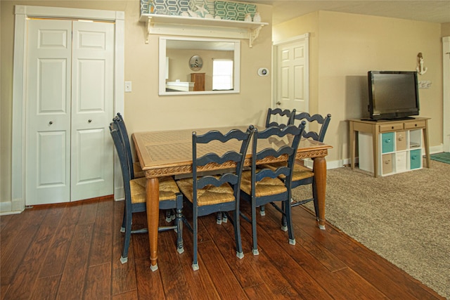 dining area featuring dark hardwood / wood-style floors