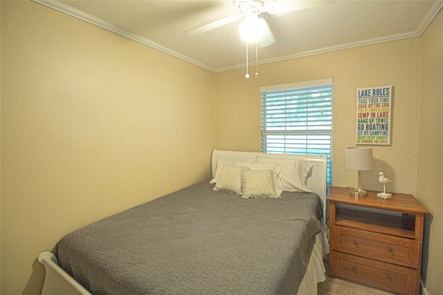 bedroom featuring crown molding and ceiling fan