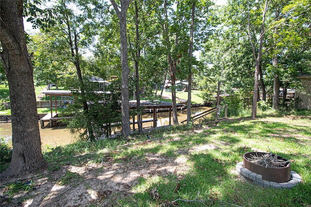 view of yard with an outdoor fire pit