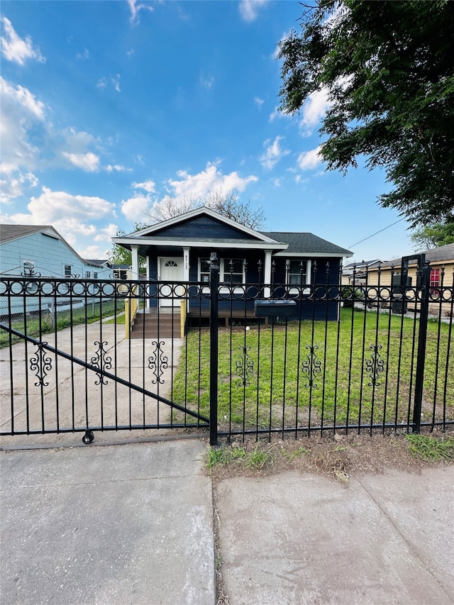 view of gate featuring a lawn