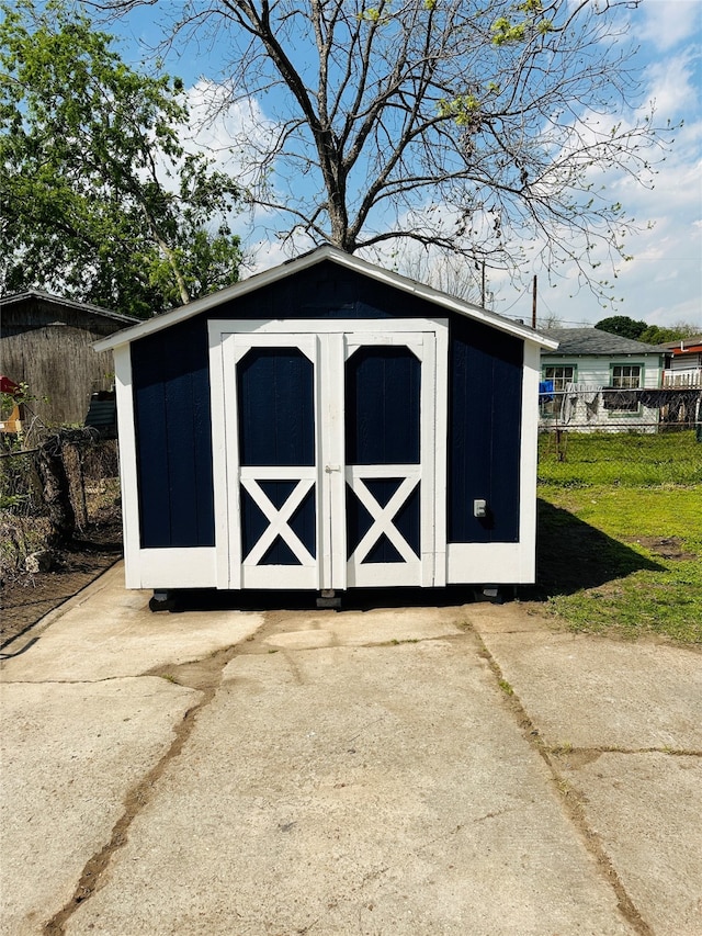 view of outdoor structure with a lawn