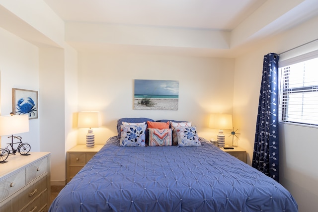 bedroom featuring dark carpet