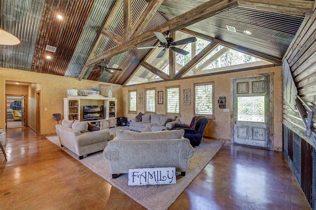 living room with beam ceiling, ceiling fan, high vaulted ceiling, and a wealth of natural light