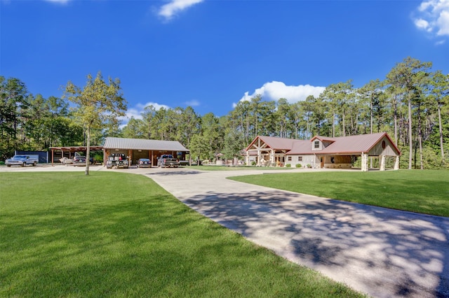 view of front facade with a carport and a front lawn