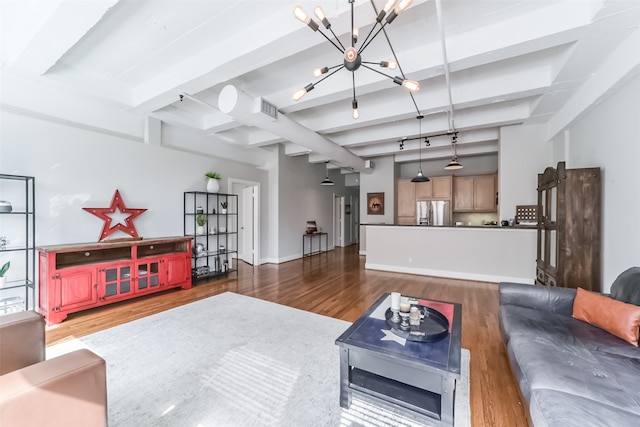 living room featuring a notable chandelier, beamed ceiling, and dark hardwood / wood-style flooring