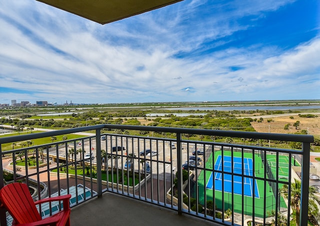 balcony featuring a water view