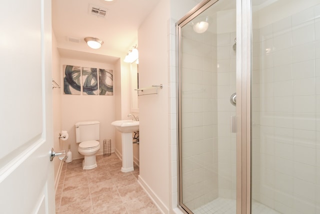 bathroom with an enclosed shower, tile flooring, and toilet