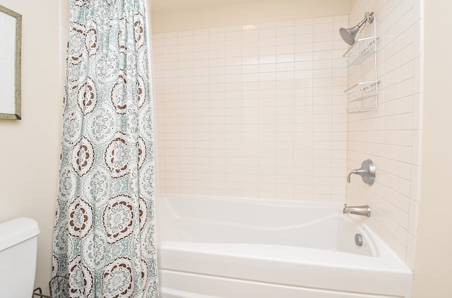 bathroom with toilet and shower / tub combo