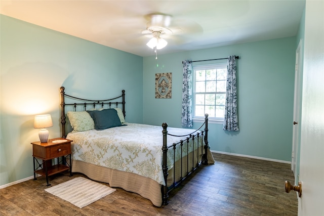 bedroom featuring hardwood / wood-style floors and ceiling fan