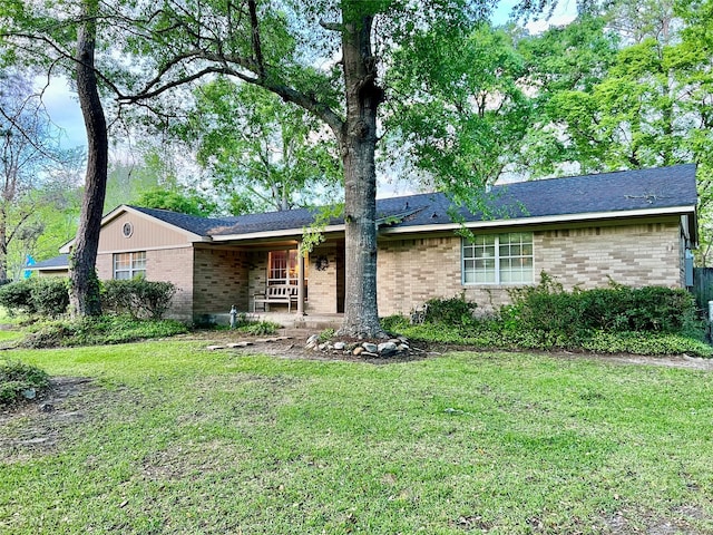 ranch-style home with a front lawn