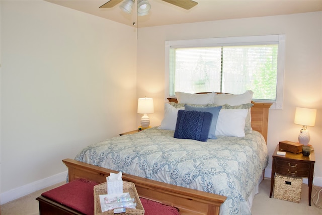 bedroom with ceiling fan and light colored carpet