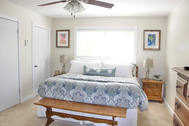 carpeted bedroom featuring ceiling fan