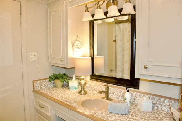 bathroom with backsplash and oversized vanity