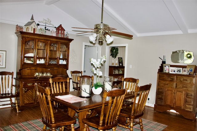 dining room with vaulted ceiling with beams, dark wood-type flooring, ceiling fan, and crown molding