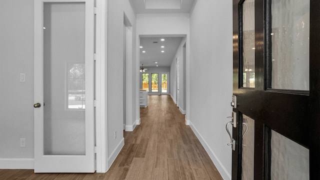 hallway with dark wood-type flooring