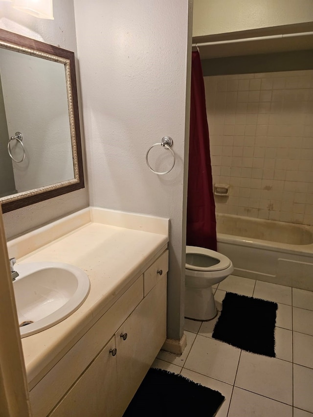 full bathroom with vanity, tile flooring, shower / bath combo with shower curtain, and toilet