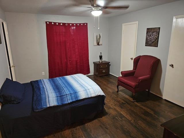 bedroom with ceiling fan and dark wood-type flooring