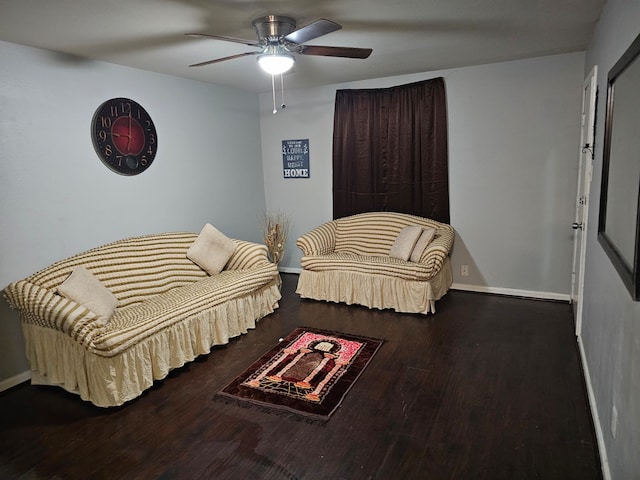 living room with dark hardwood / wood-style flooring and ceiling fan