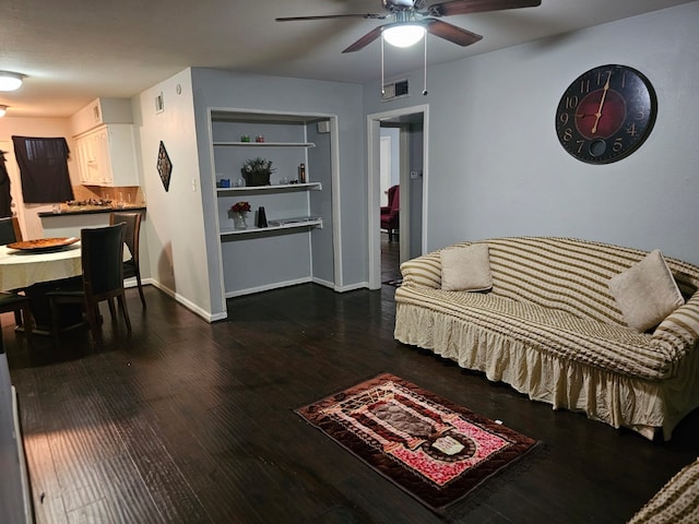 living room with dark hardwood / wood-style floors and ceiling fan