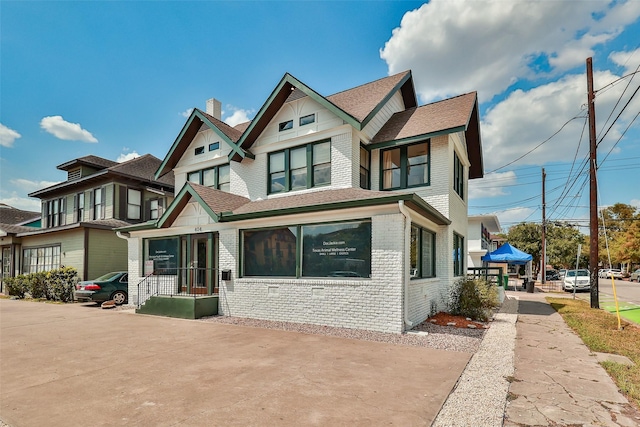 victorian home with brick siding