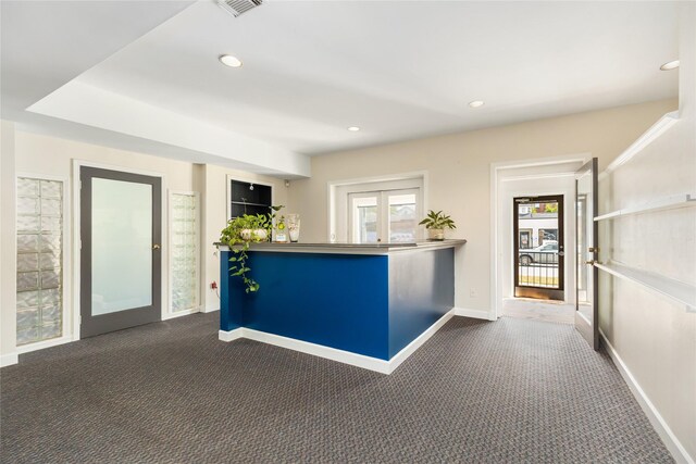 kitchen with dark carpet and french doors