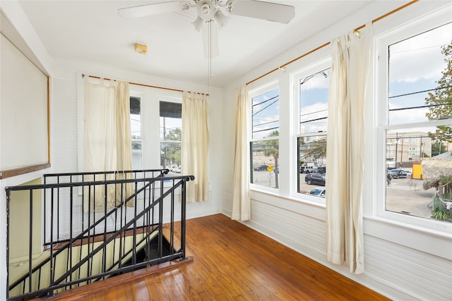 hallway with hardwood / wood-style flooring