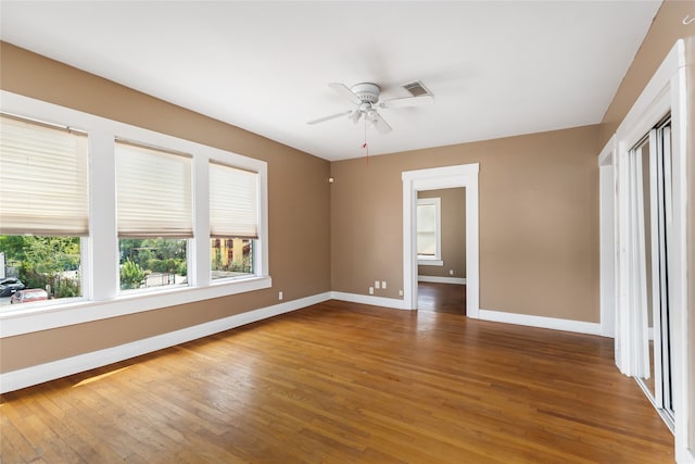 unfurnished room featuring ceiling fan and wood-type flooring