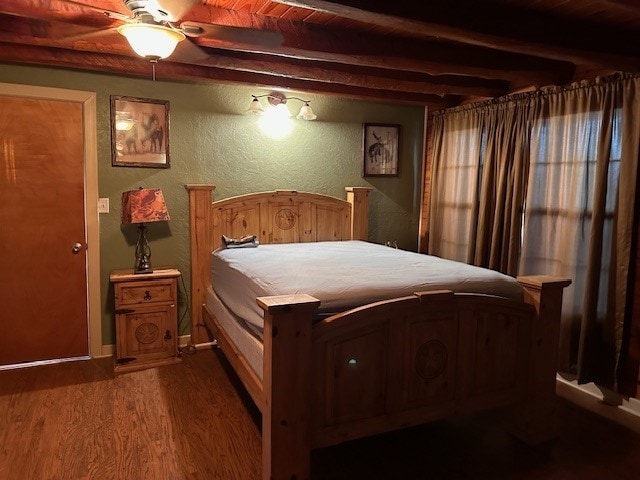 bedroom featuring beamed ceiling, ceiling fan, wood-type flooring, and wooden ceiling