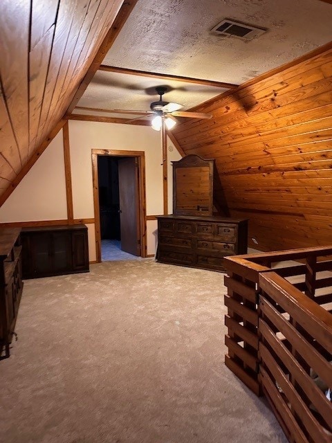 additional living space with light colored carpet, ceiling fan, lofted ceiling, and wood ceiling