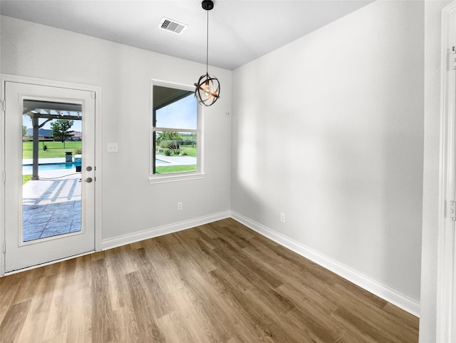 interior space with a wealth of natural light and wood-type flooring